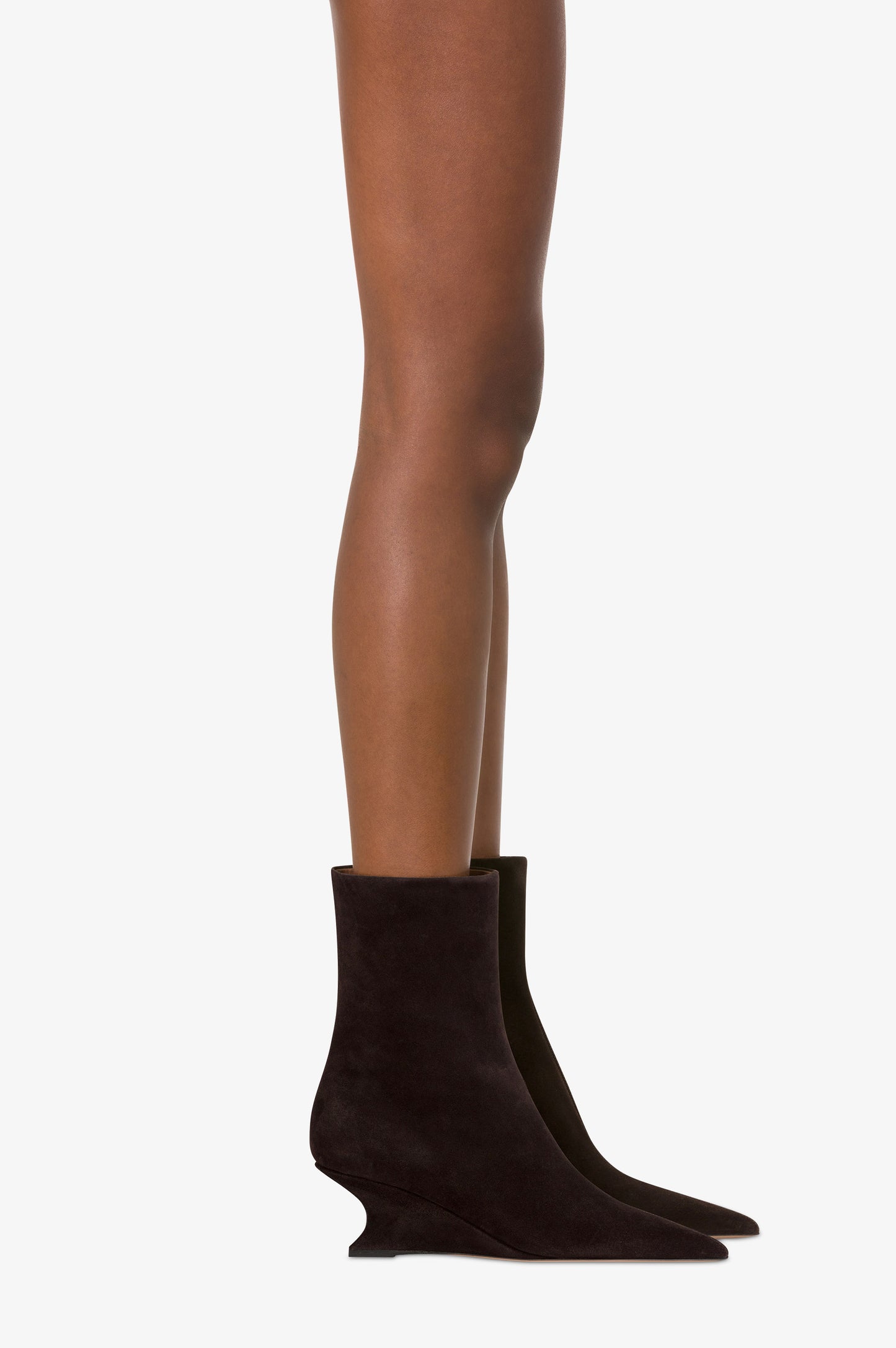Ankle boots in ebony calf suede leather.