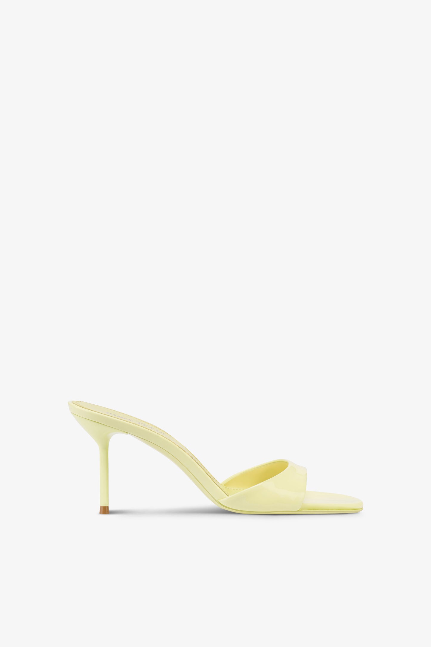 Mules in light yellow patent leather