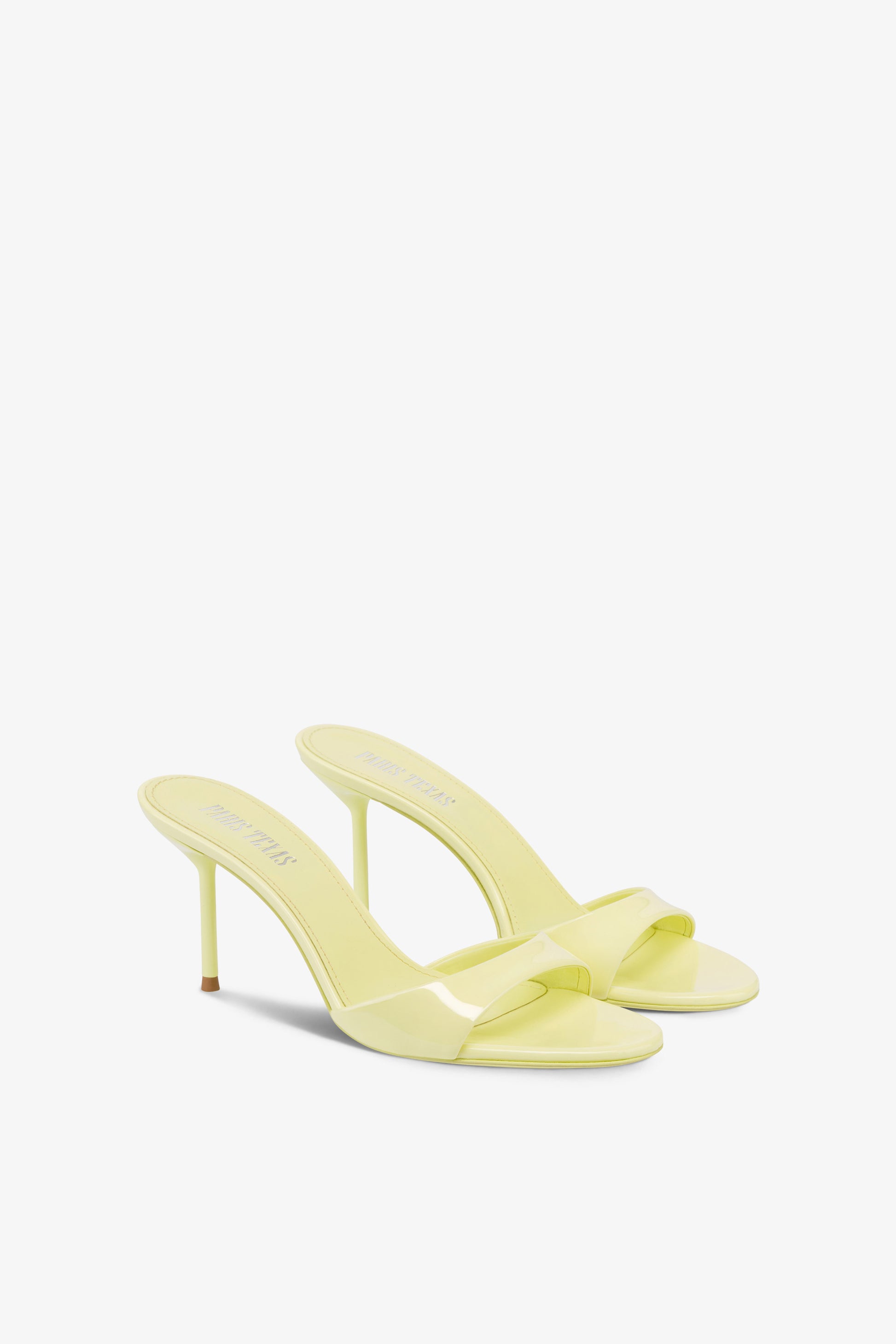 Mules in light yellow patent leather