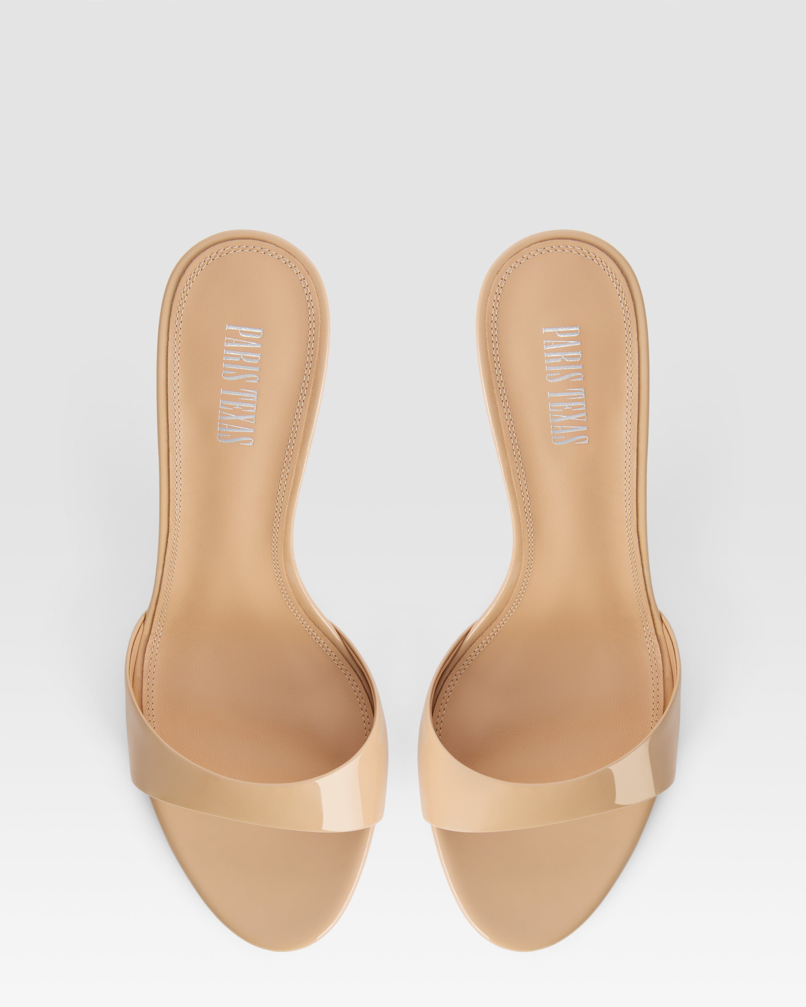 Mules in honey patent leather