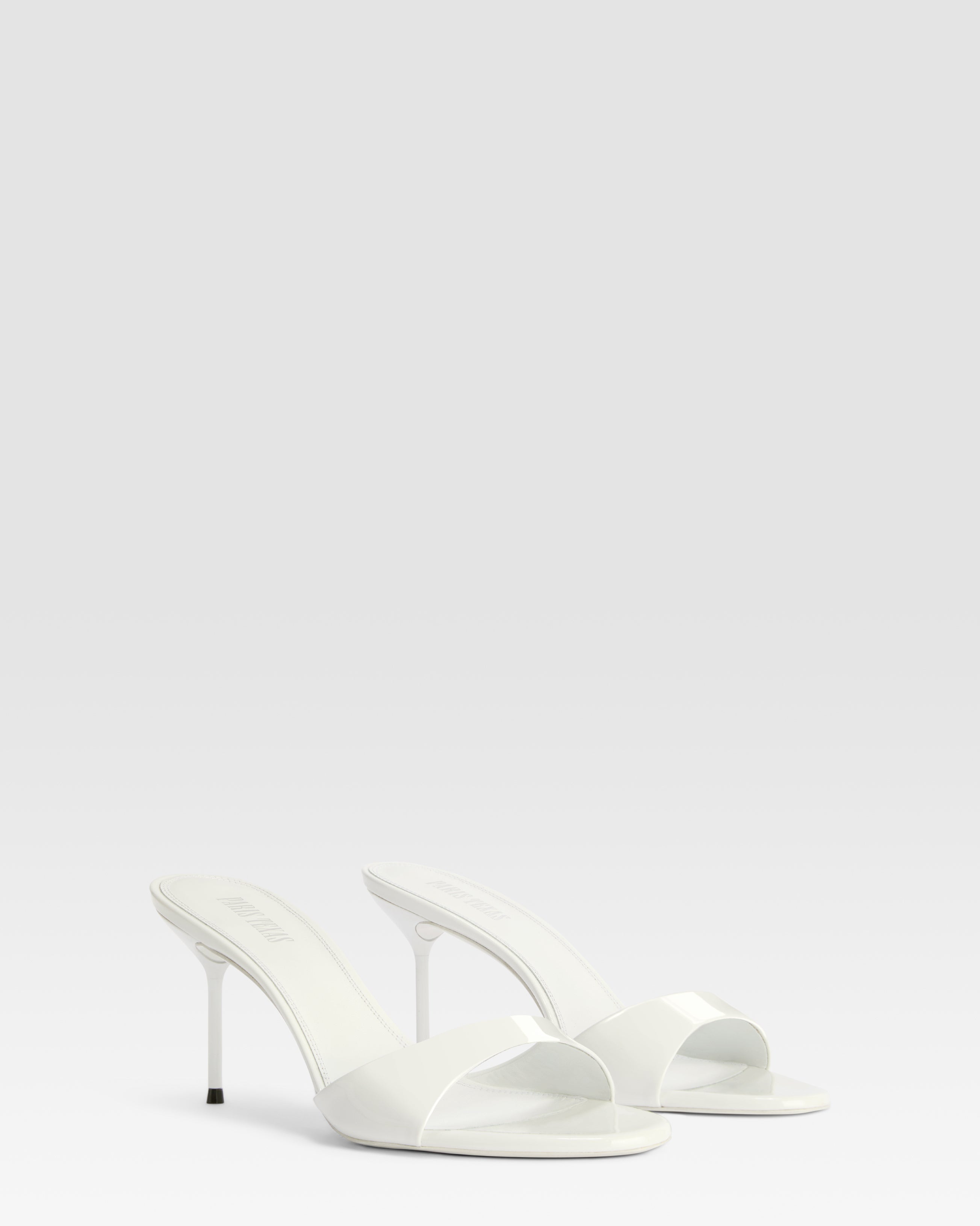 Mules in optic white patent leather