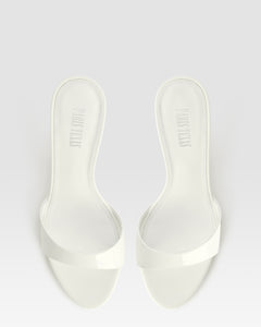 Mules in optic white patent leather