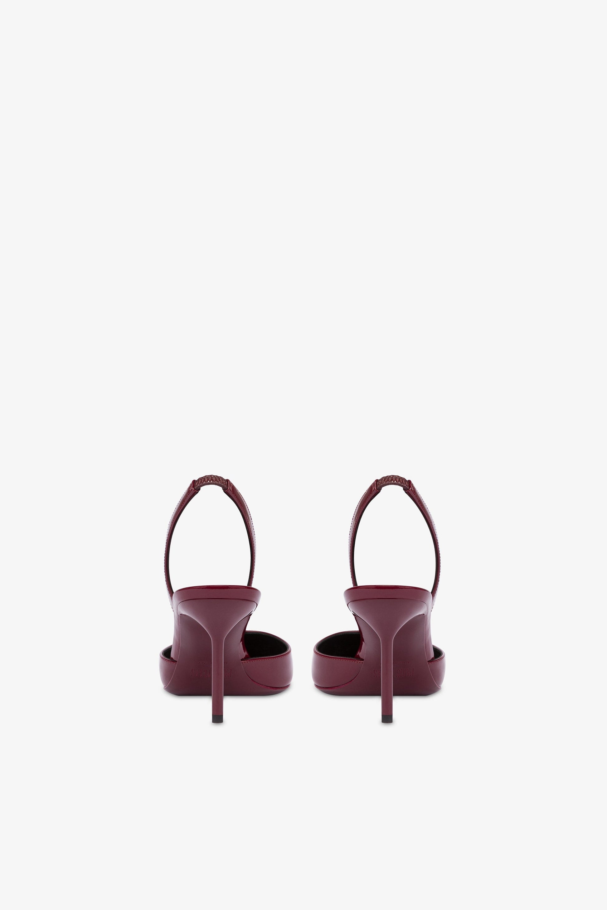 Long, pointed slingbacks in patent rouge noir leather