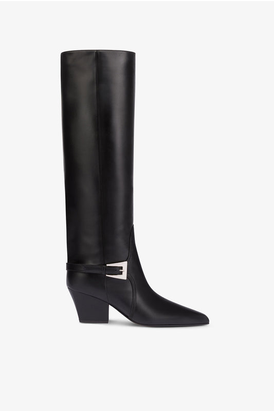 Long, pointed knee-high boots in smooth black leather