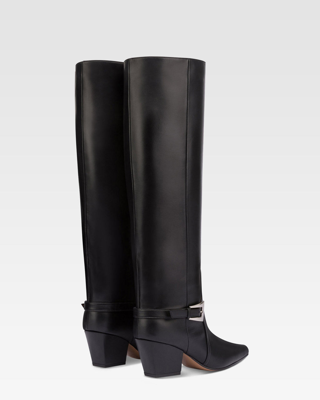 Long, pointed knee-high boots in smooth black leather