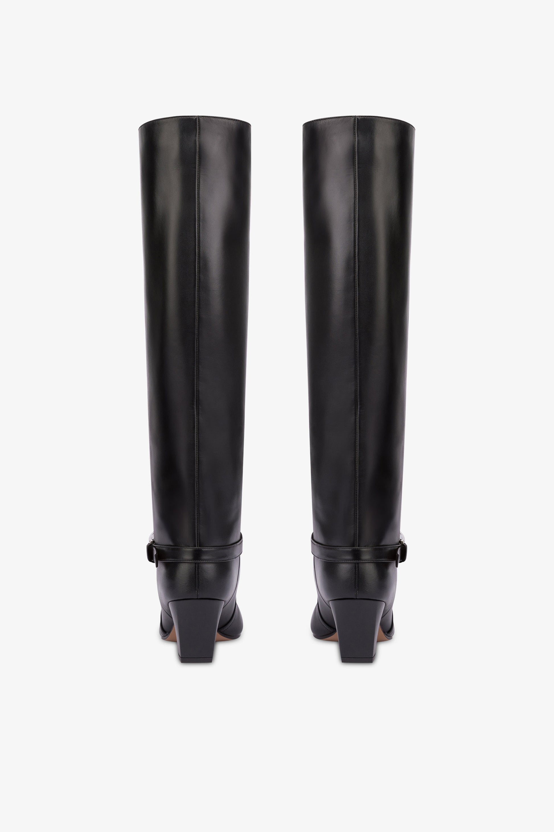 Long, pointed knee-high boots in smooth black leather