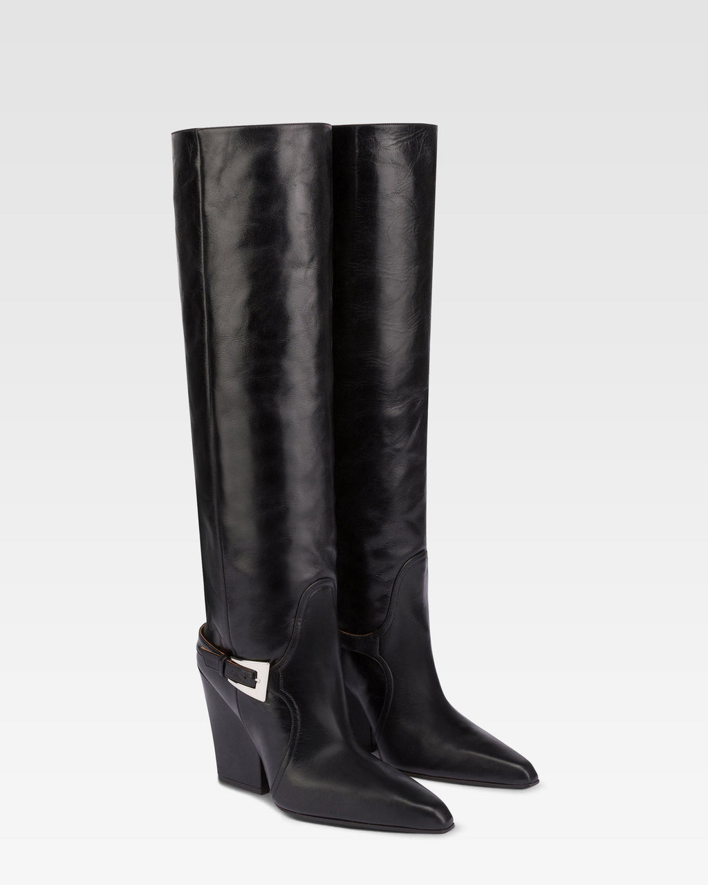 Tall, knee-high boots in shiny black vintage leather