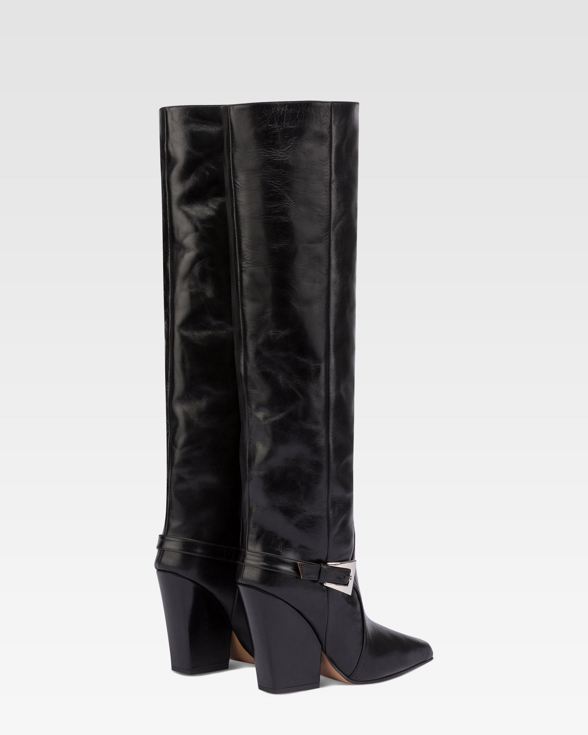 Tall, knee-high boots in shiny black vintage leather