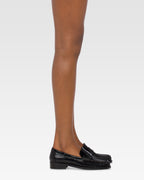 Mocassini con maxi goffratura coccodrillo su pelle di vitello nera