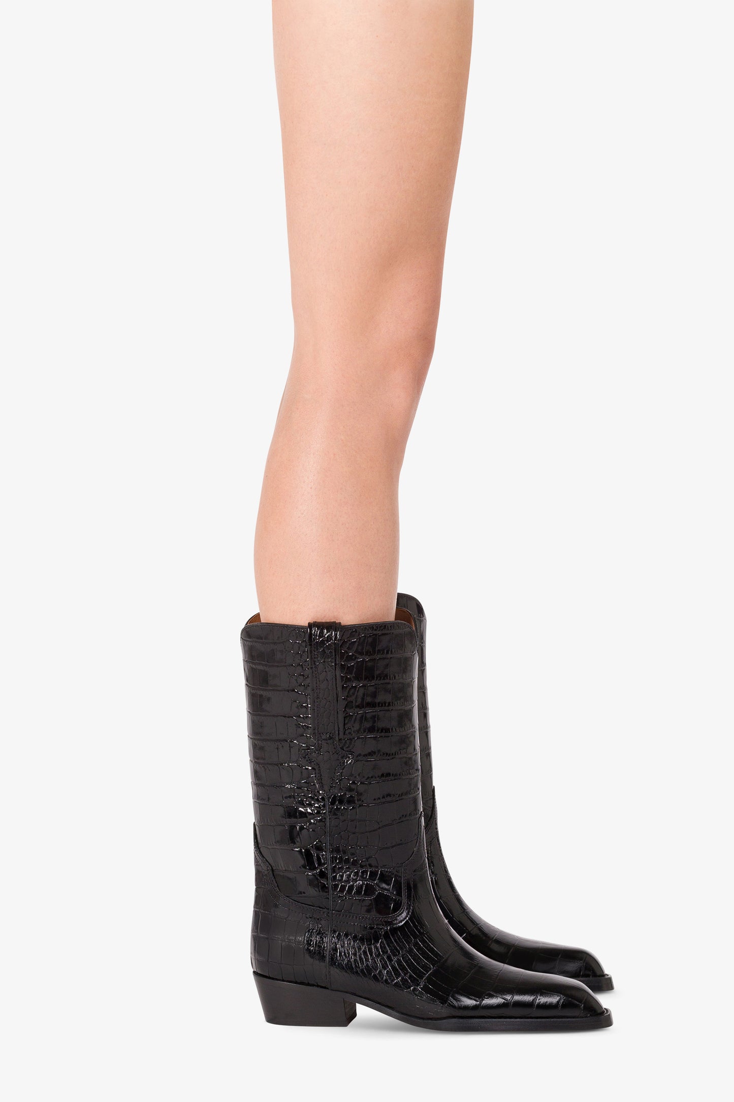 Boots in black croco-embossed leather