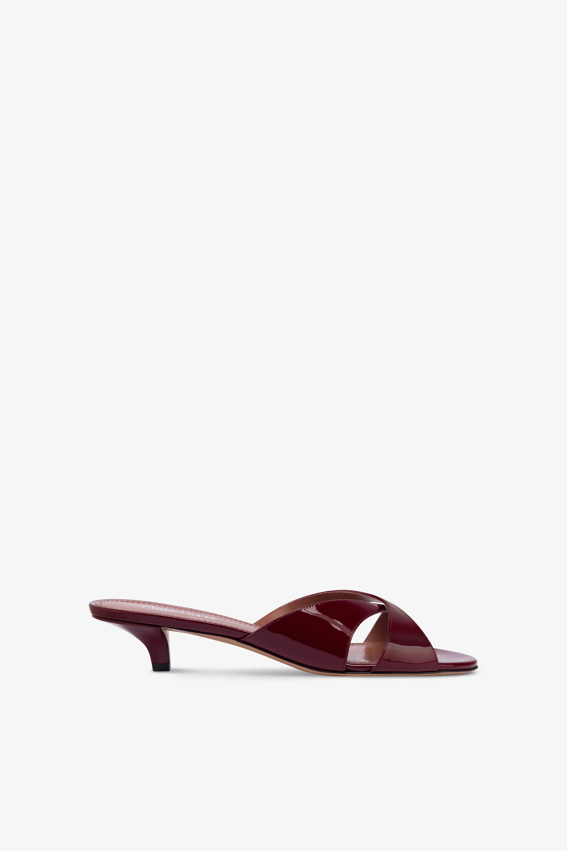 Mules in patent rouge noir leather