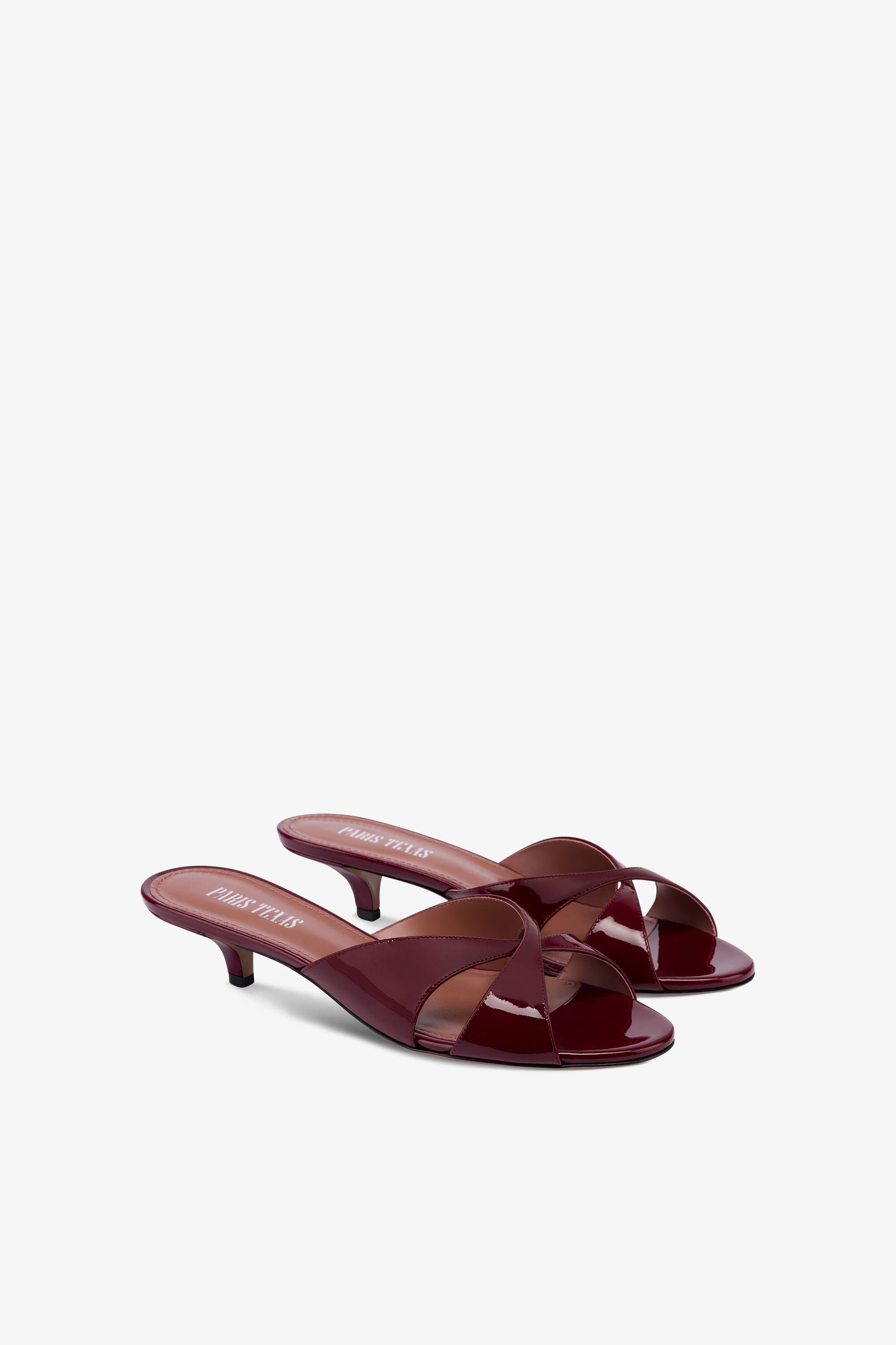 Mules in patent rouge noir leather