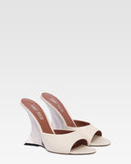 Mules in pelle bianca e zeppa galvanizzata