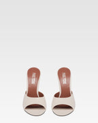 Mules in pelle bianca e zeppa galvanizzata