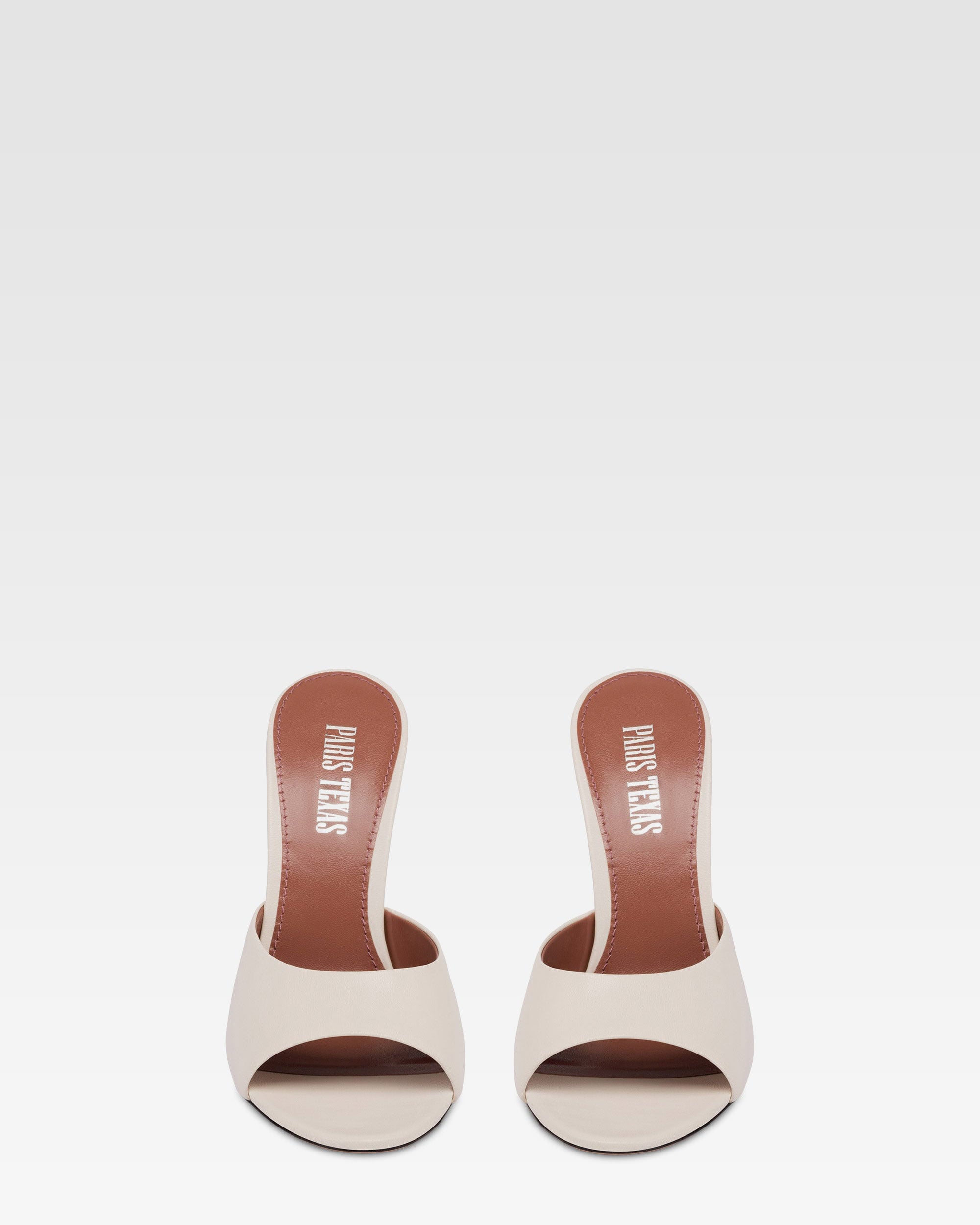 Mules in pelle bianca e zeppa galvanizzata