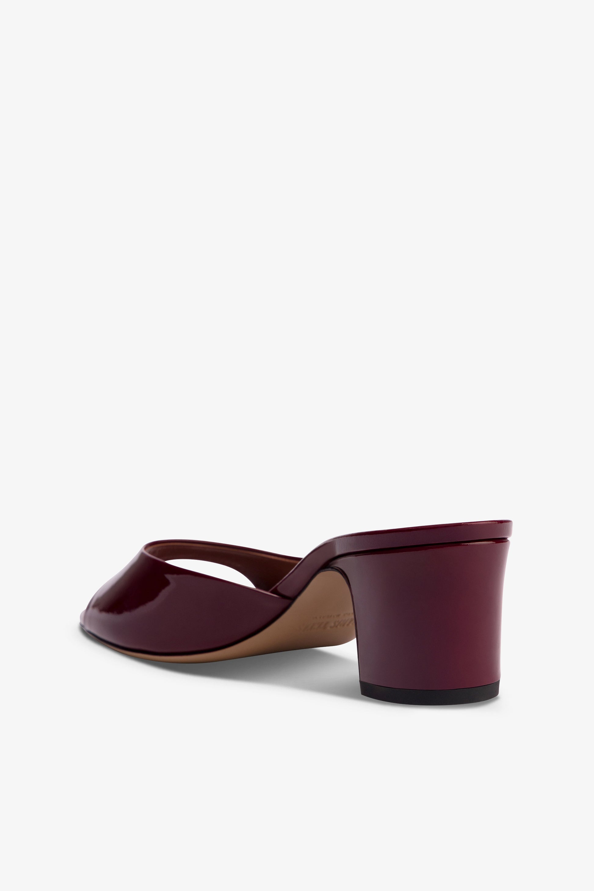 Mules in rouge noir patent leather