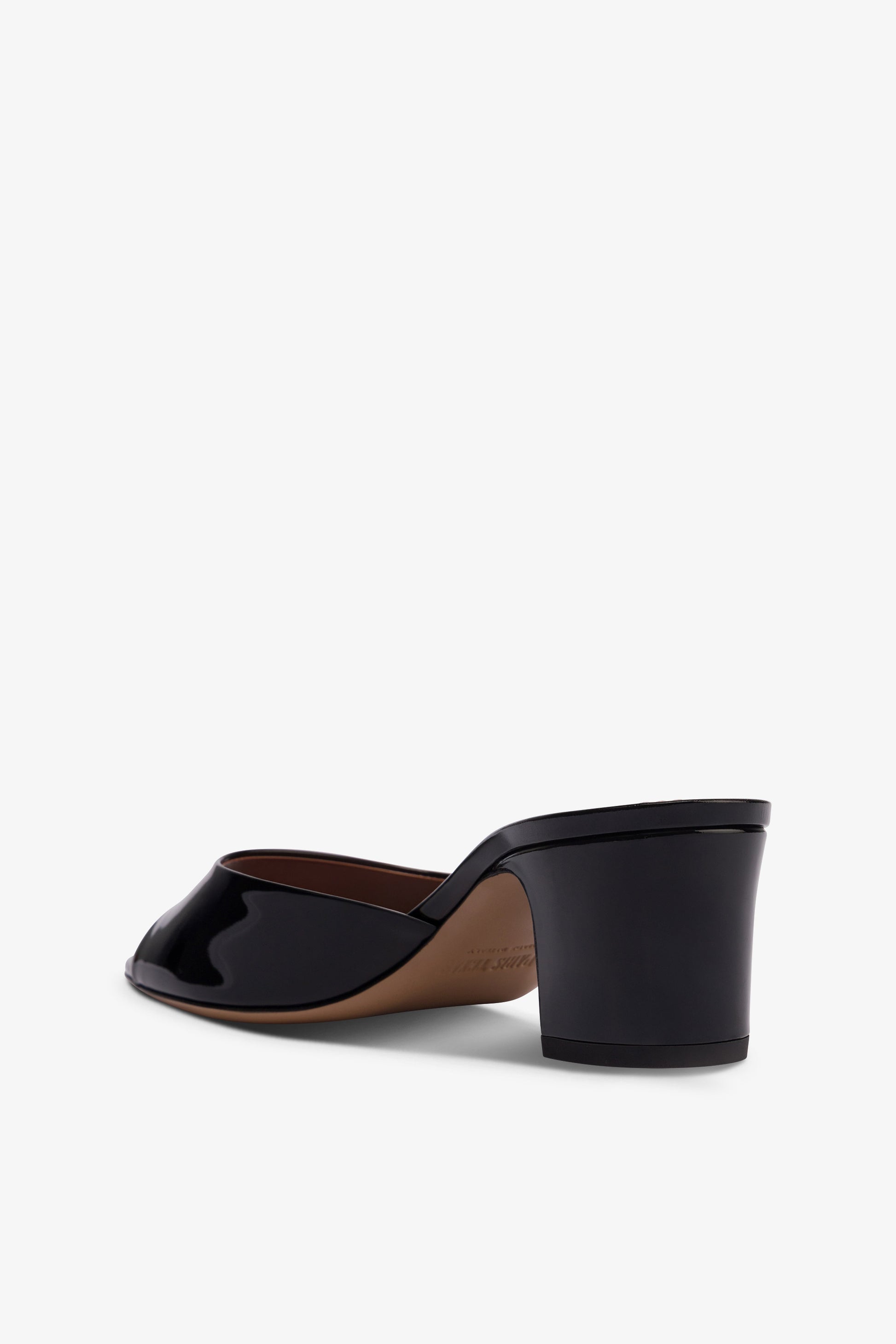 Mules in black patent leather