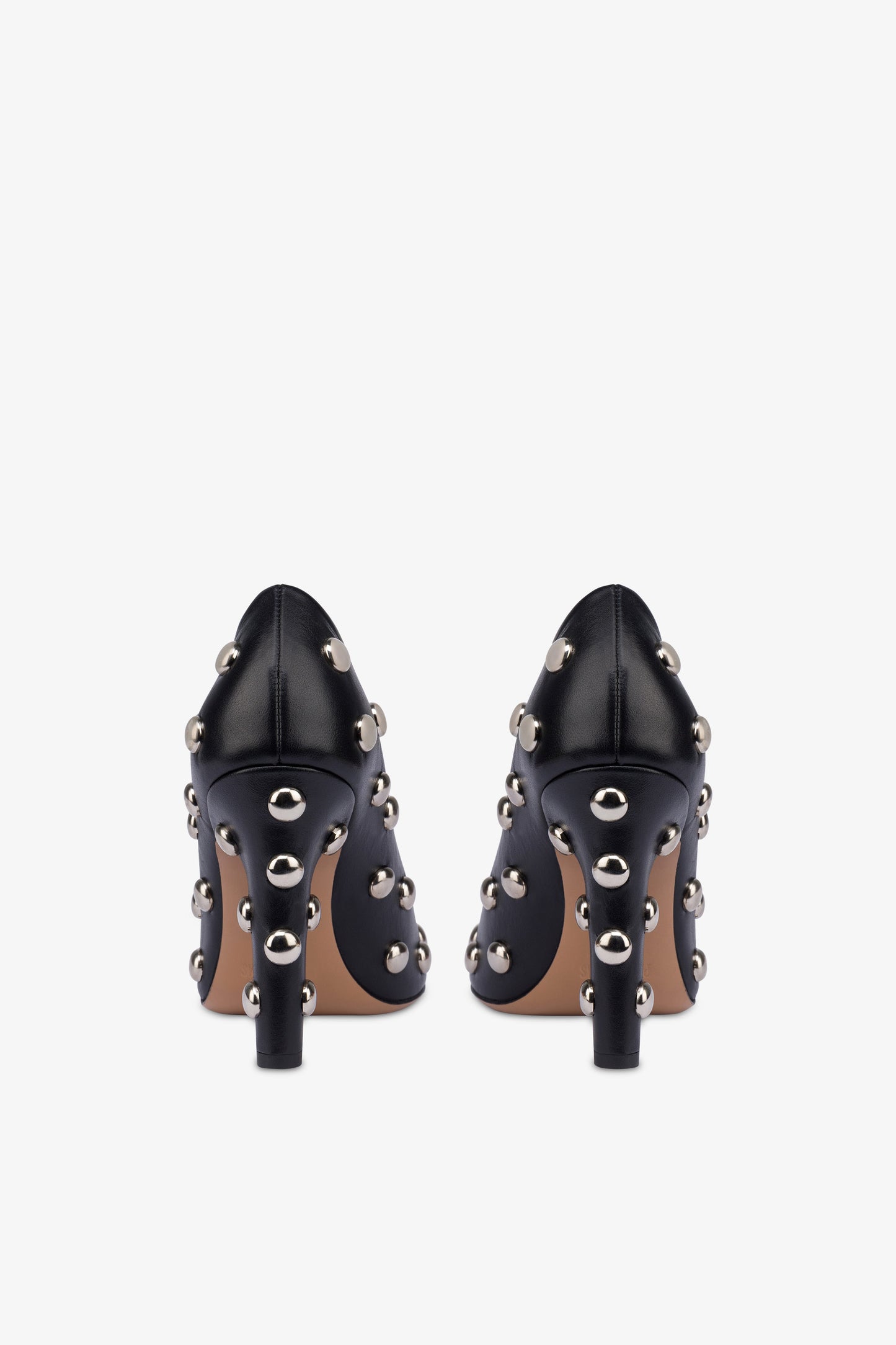 Pumps in nickel-studded black leather