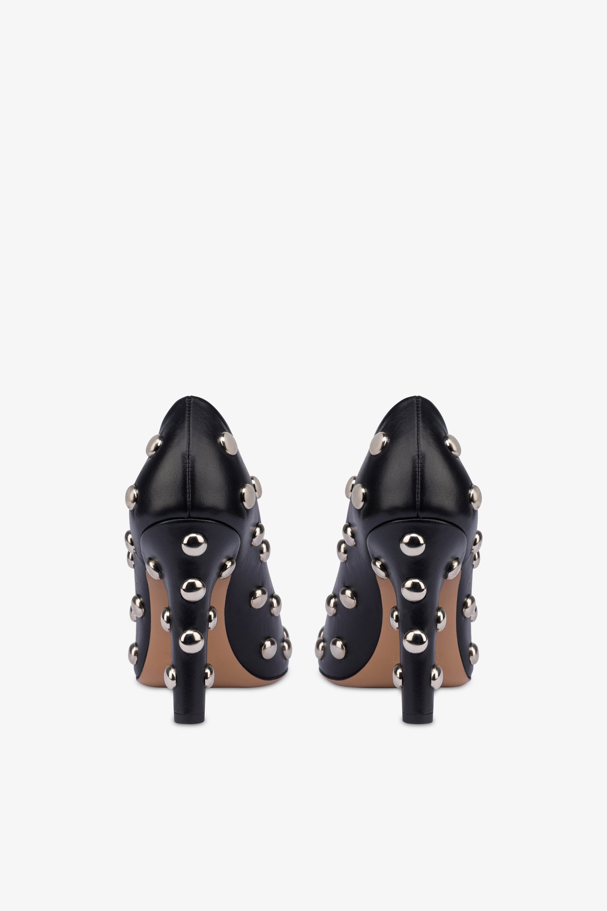 Pumps in nickel-studded black leather