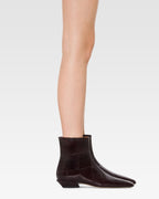 Ankle boots in rouge noir croco-embossed leather