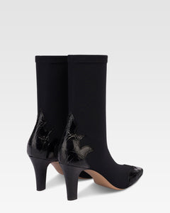 Boots in black croco-embossed and stretchy leather