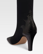 Boots in black croco-embossed and stretchy leather