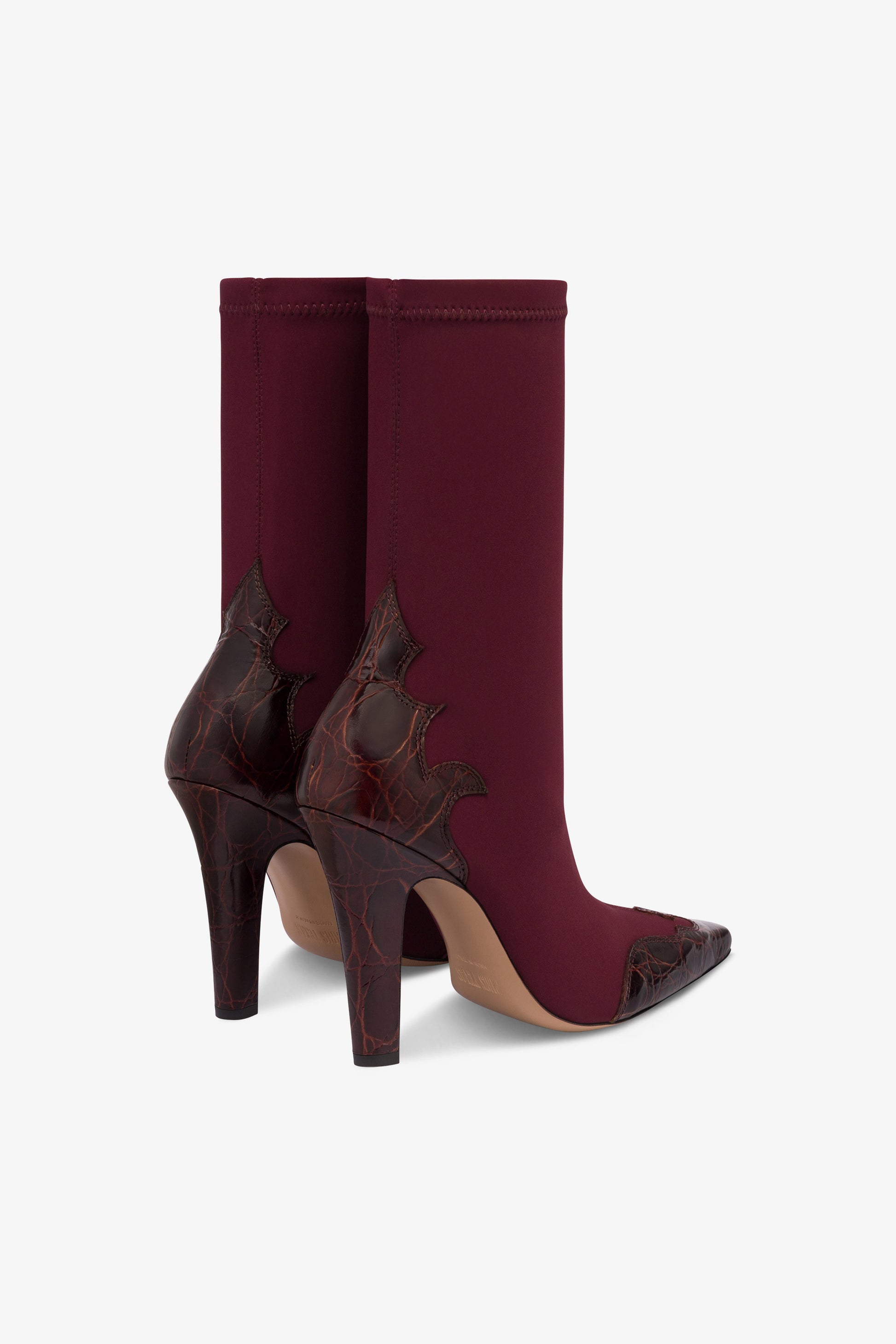 Boots in burgundy croco-embossed and stretchy leather