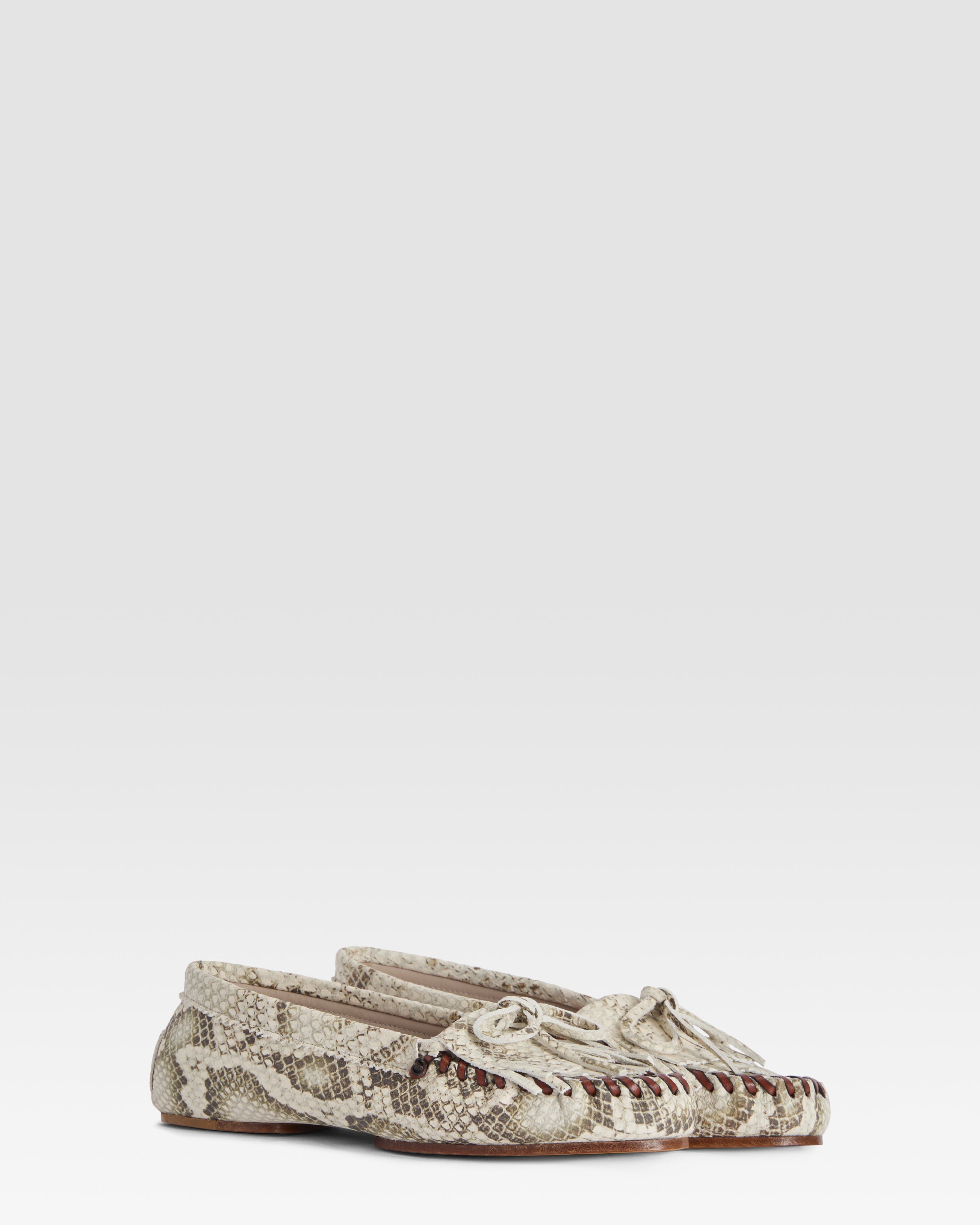 Loafers in natural printed python leather
