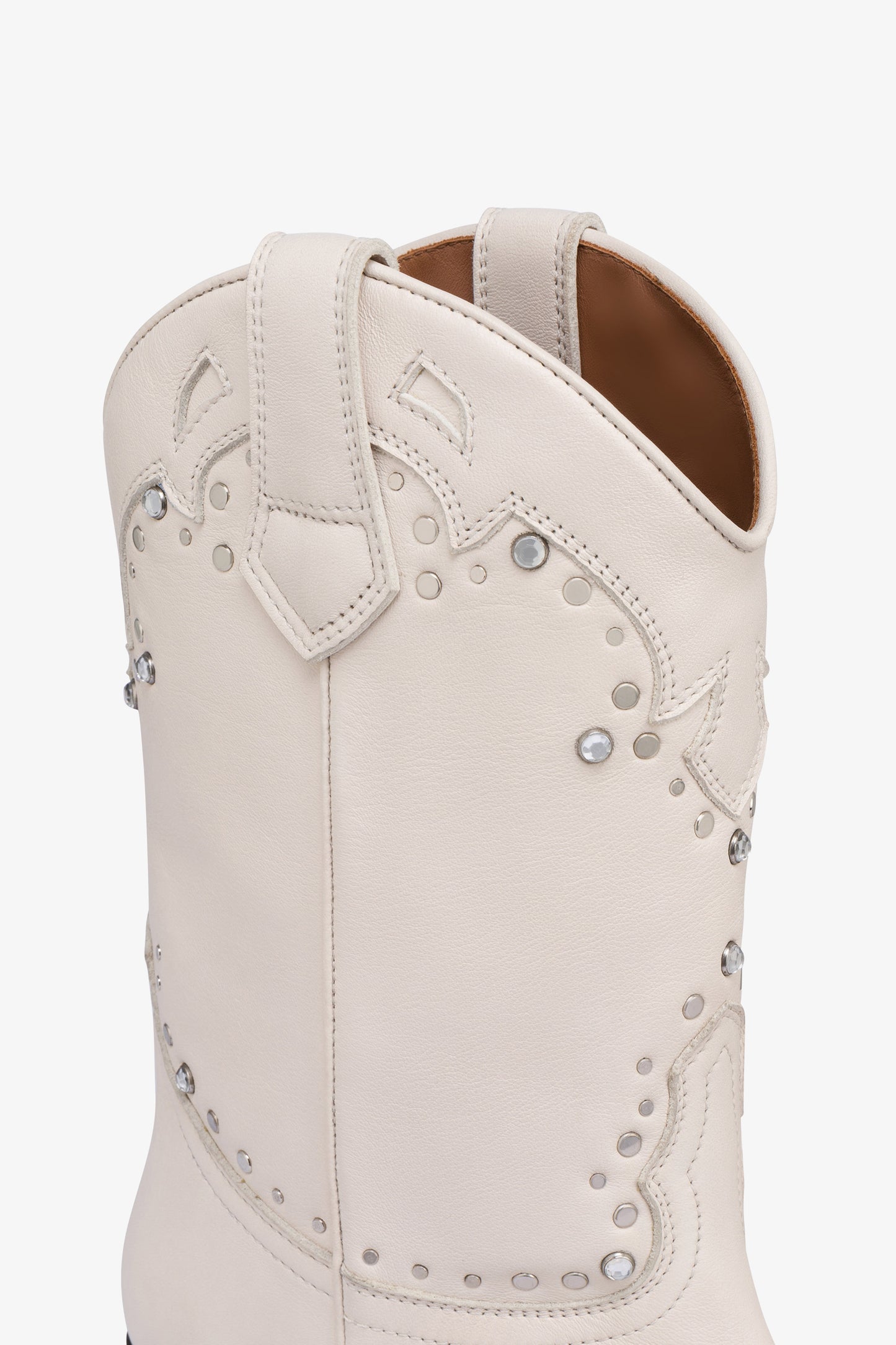 Boots in nickel-studded milk white leather