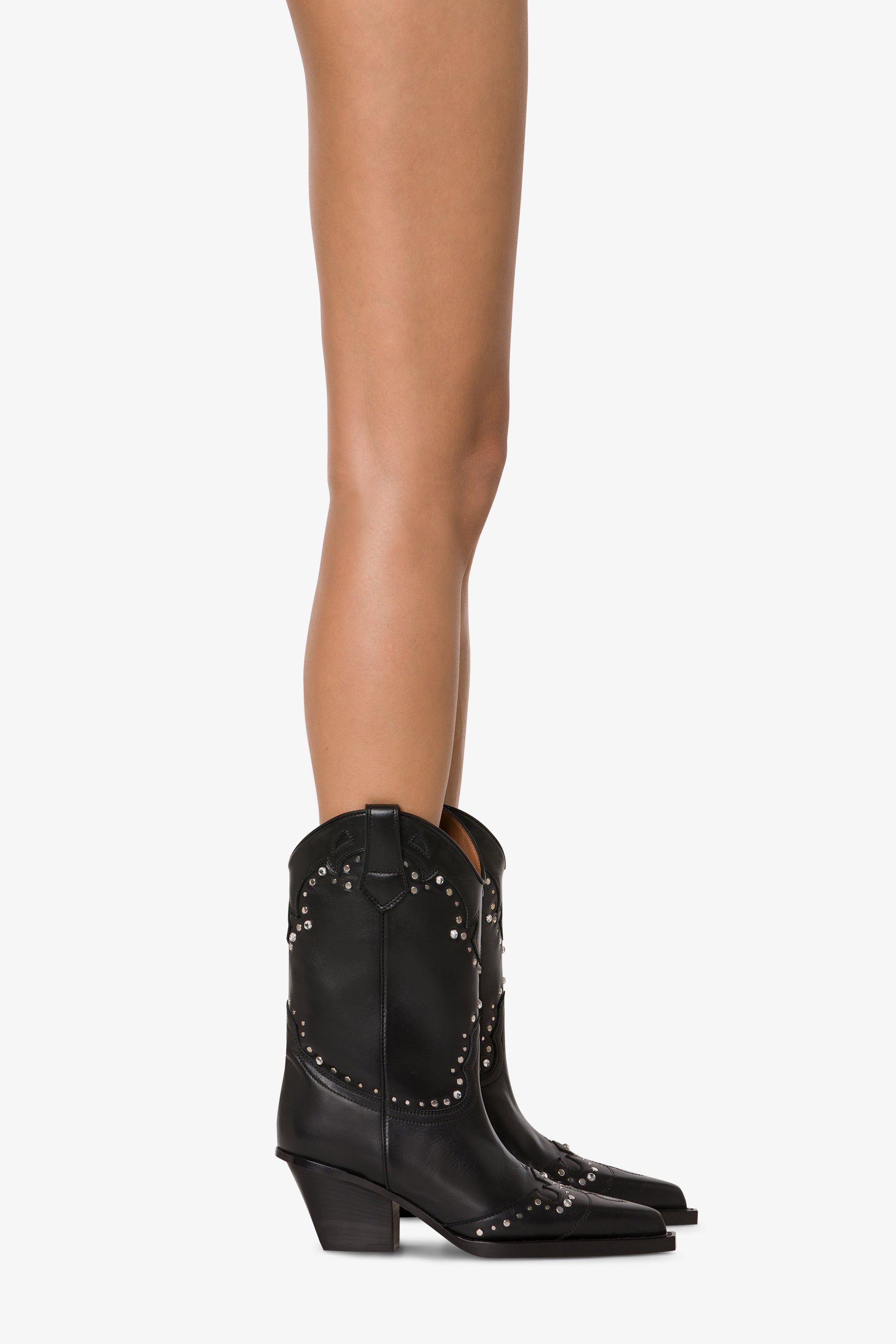 Boots in nickel-studded black leather