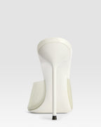 Mules in latte patent leather