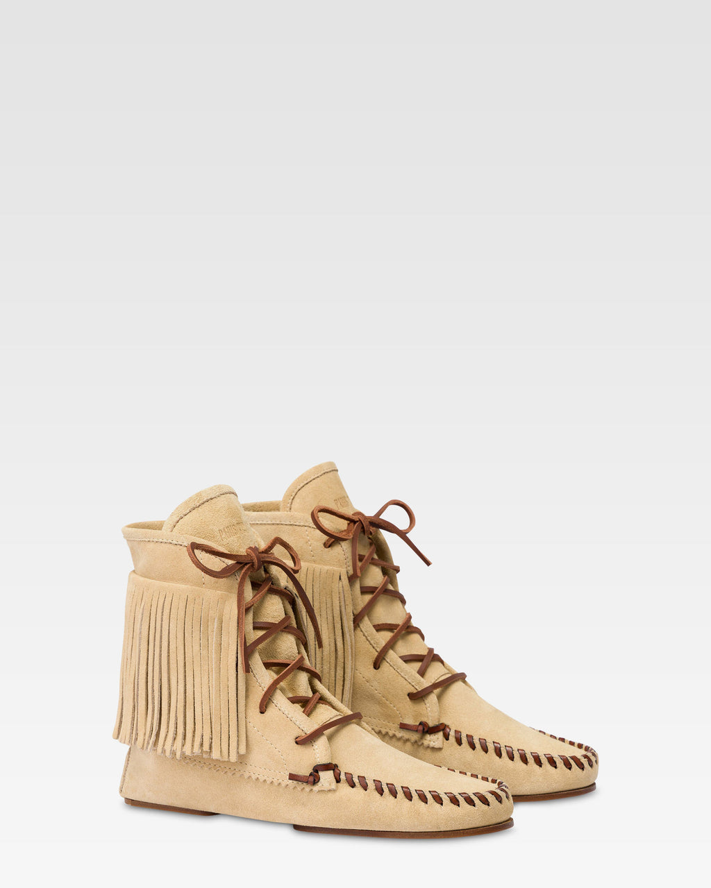Boots in ecru suede leather