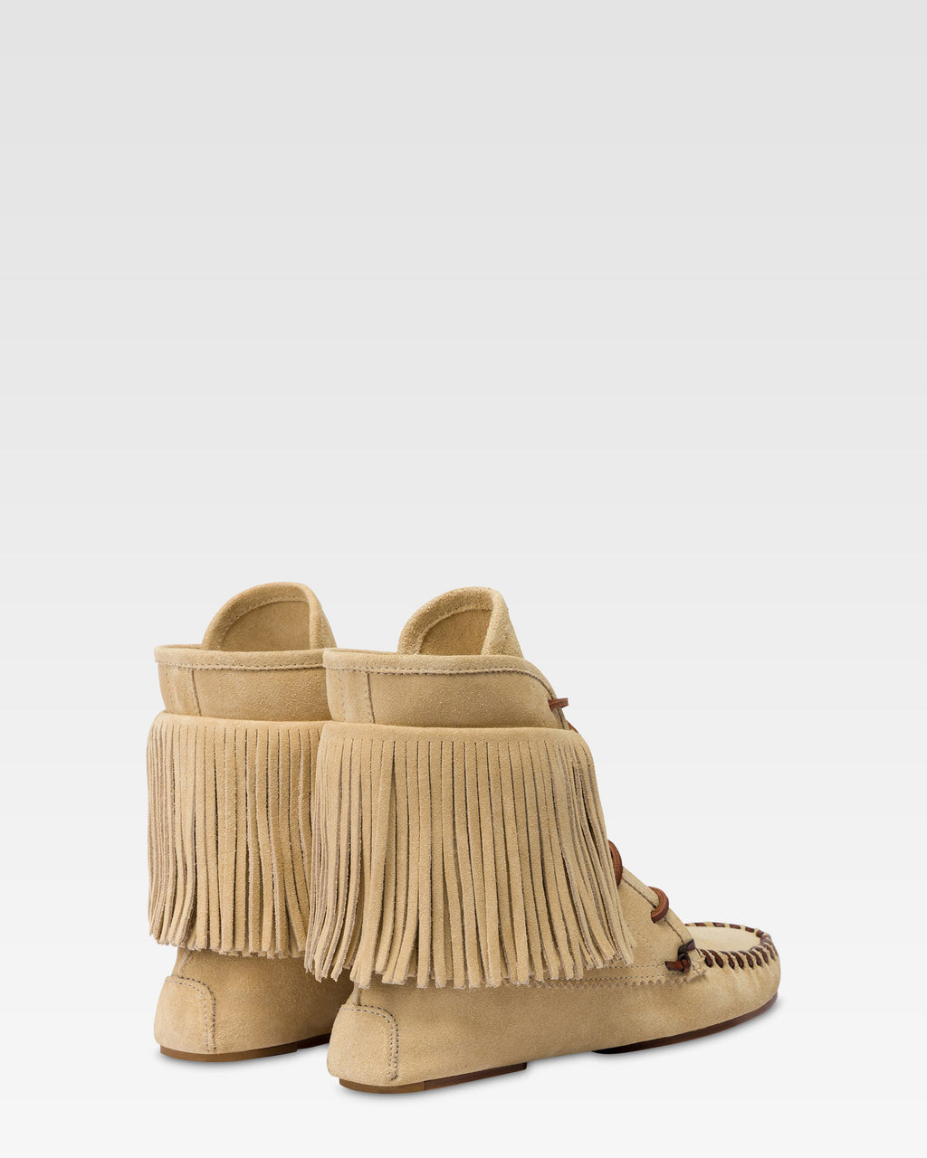 Boots in ecru suede leather