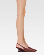 Slingbacks in rouge noir suede leather with lizard print leather heel