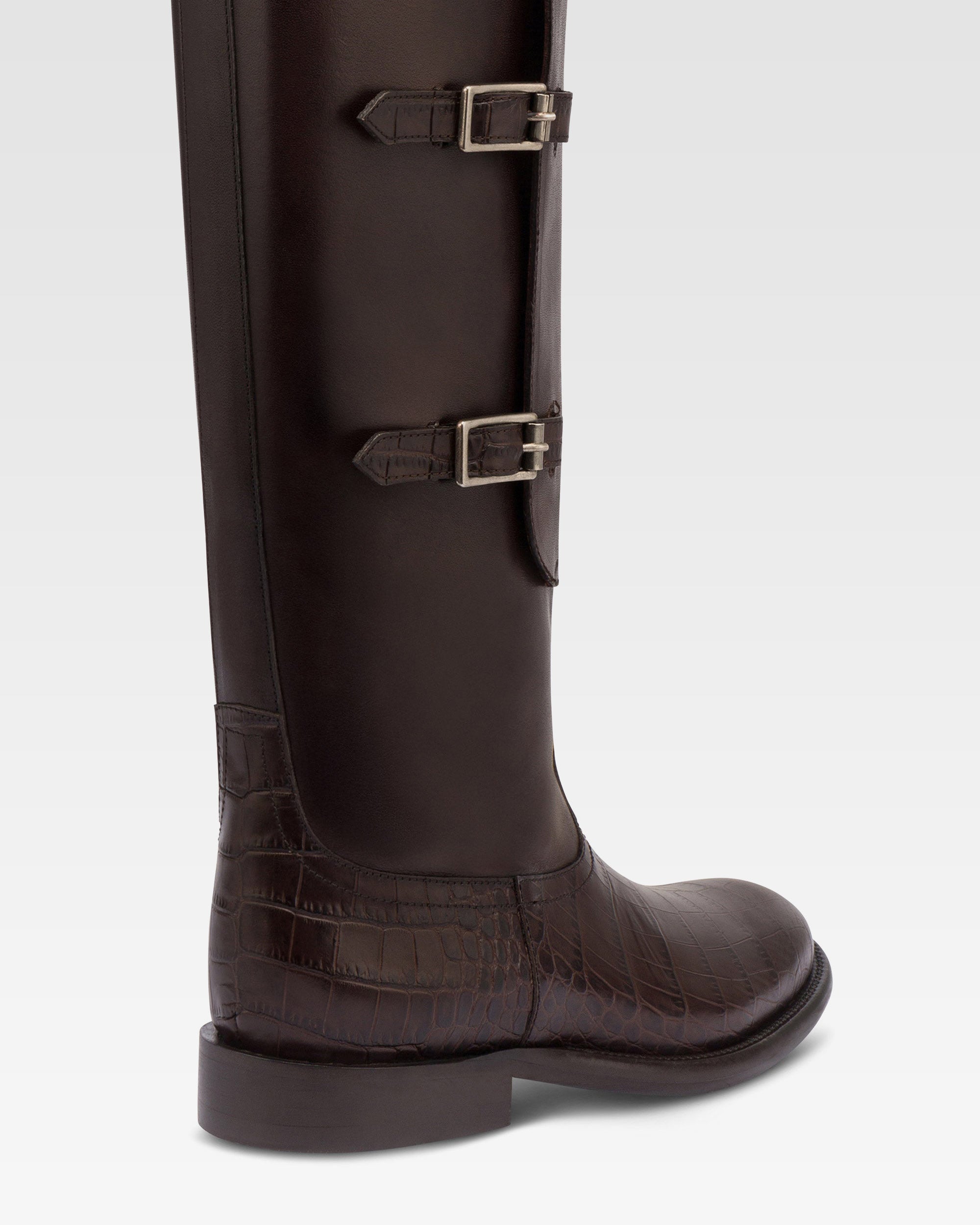 Boots in ebony calf leather with croco-embossed details