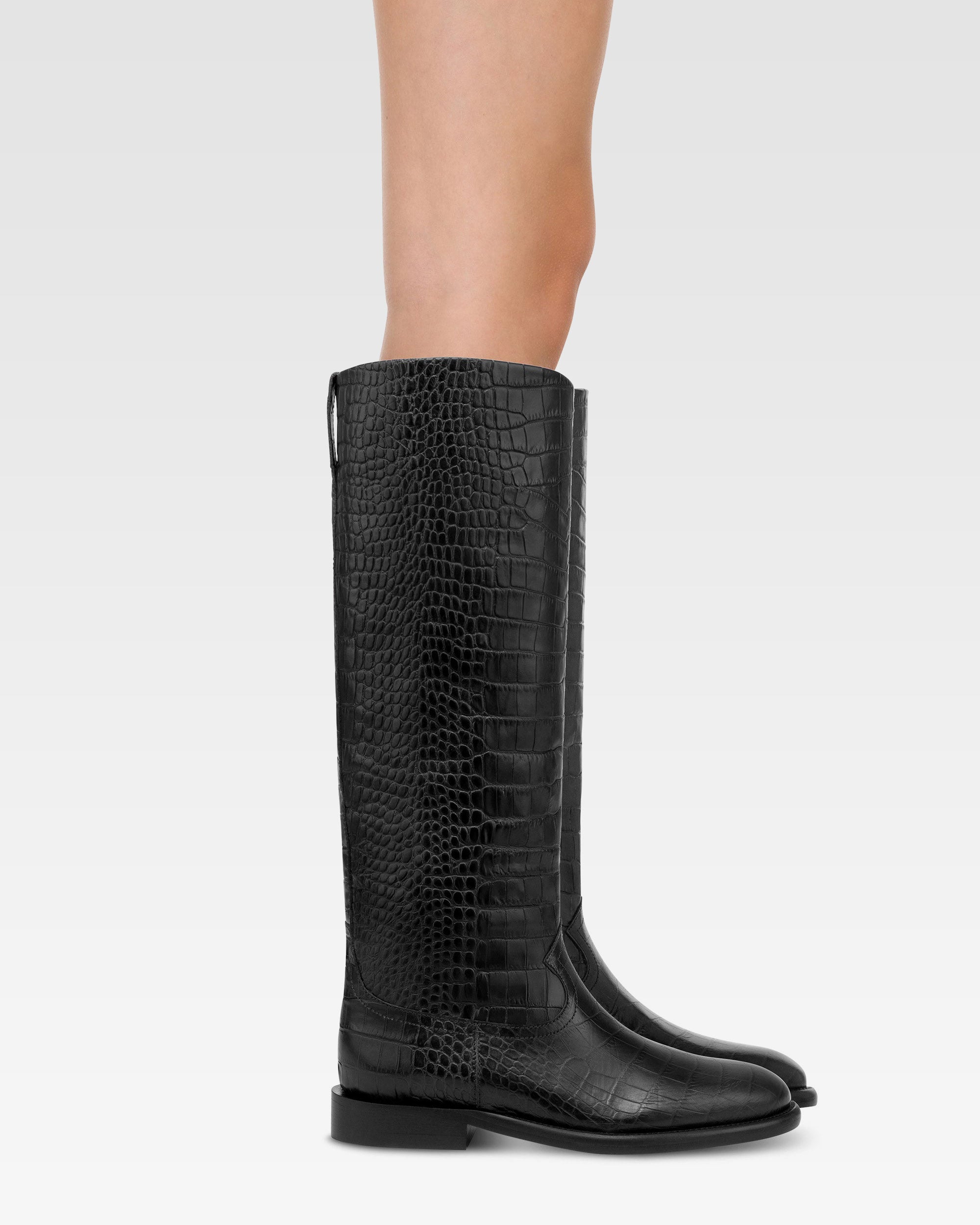Boots in black croco-embossed leather