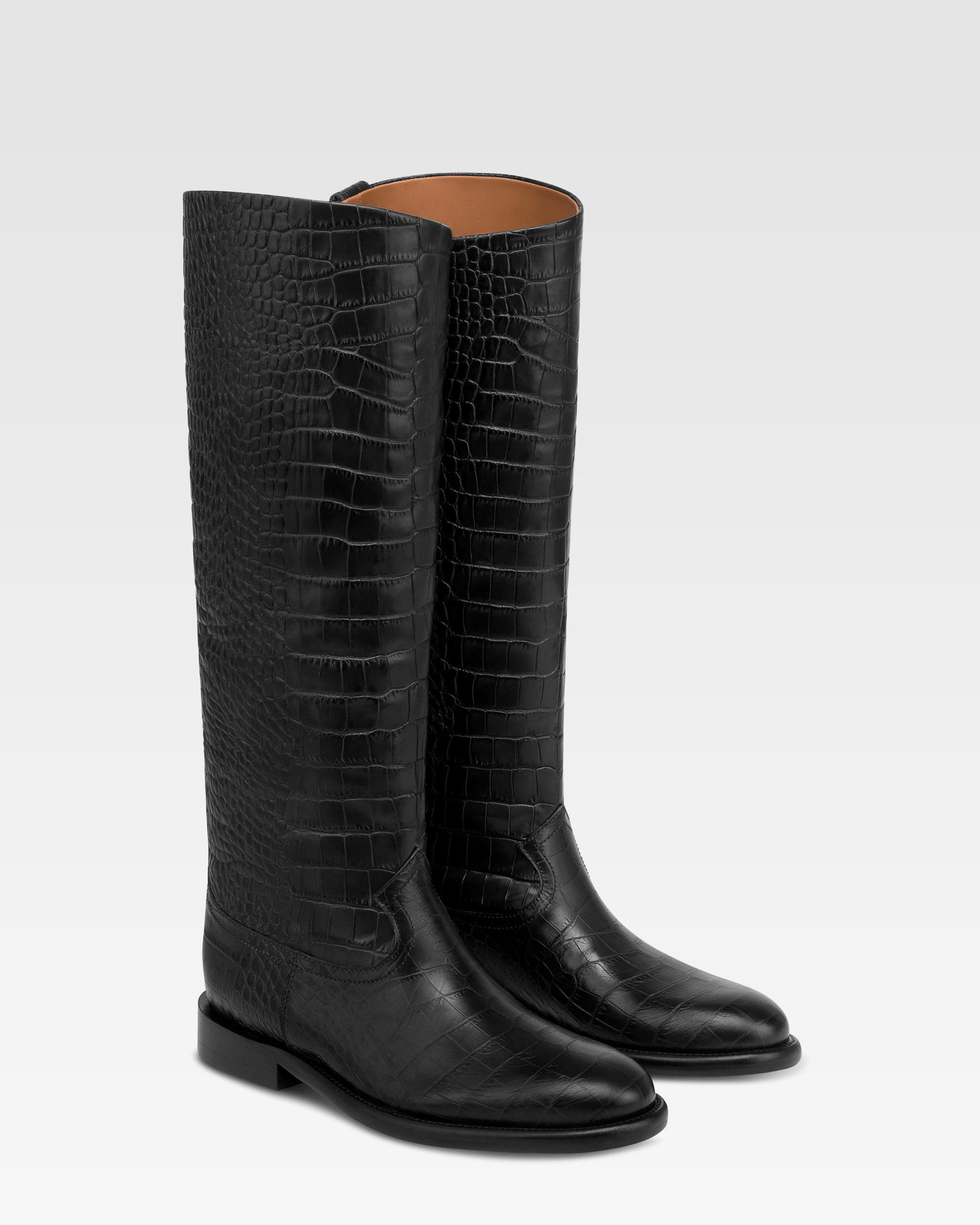 Boots in black croco-embossed leather