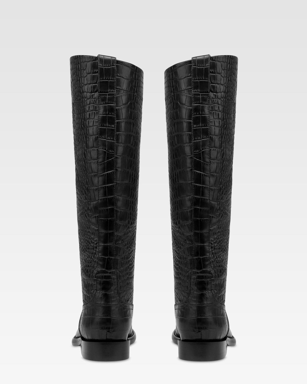 Boots in black croco-embossed leather