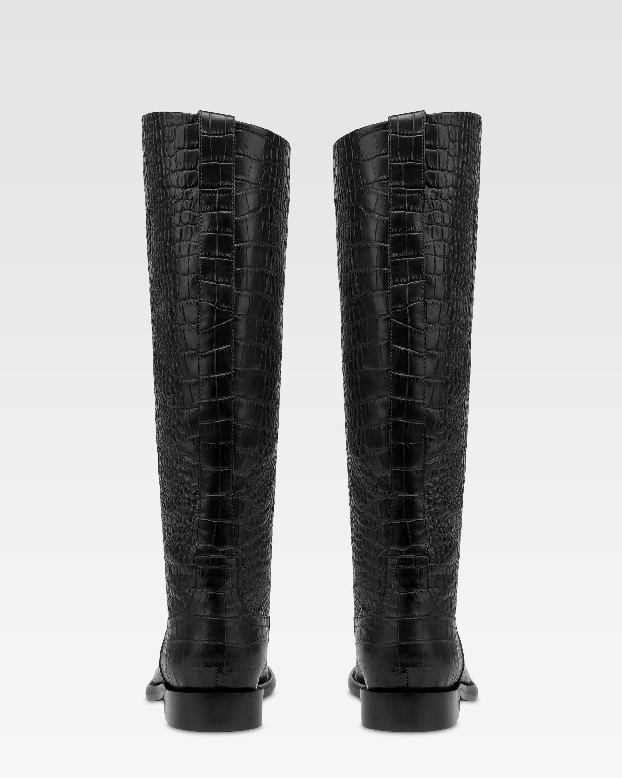 Boots in black croco-embossed leather