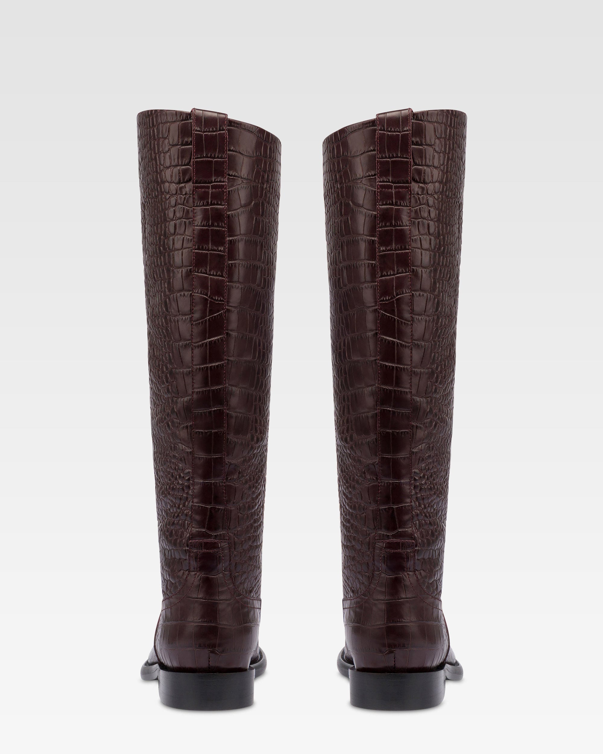 Boots in rouge noir croco-embossed leather