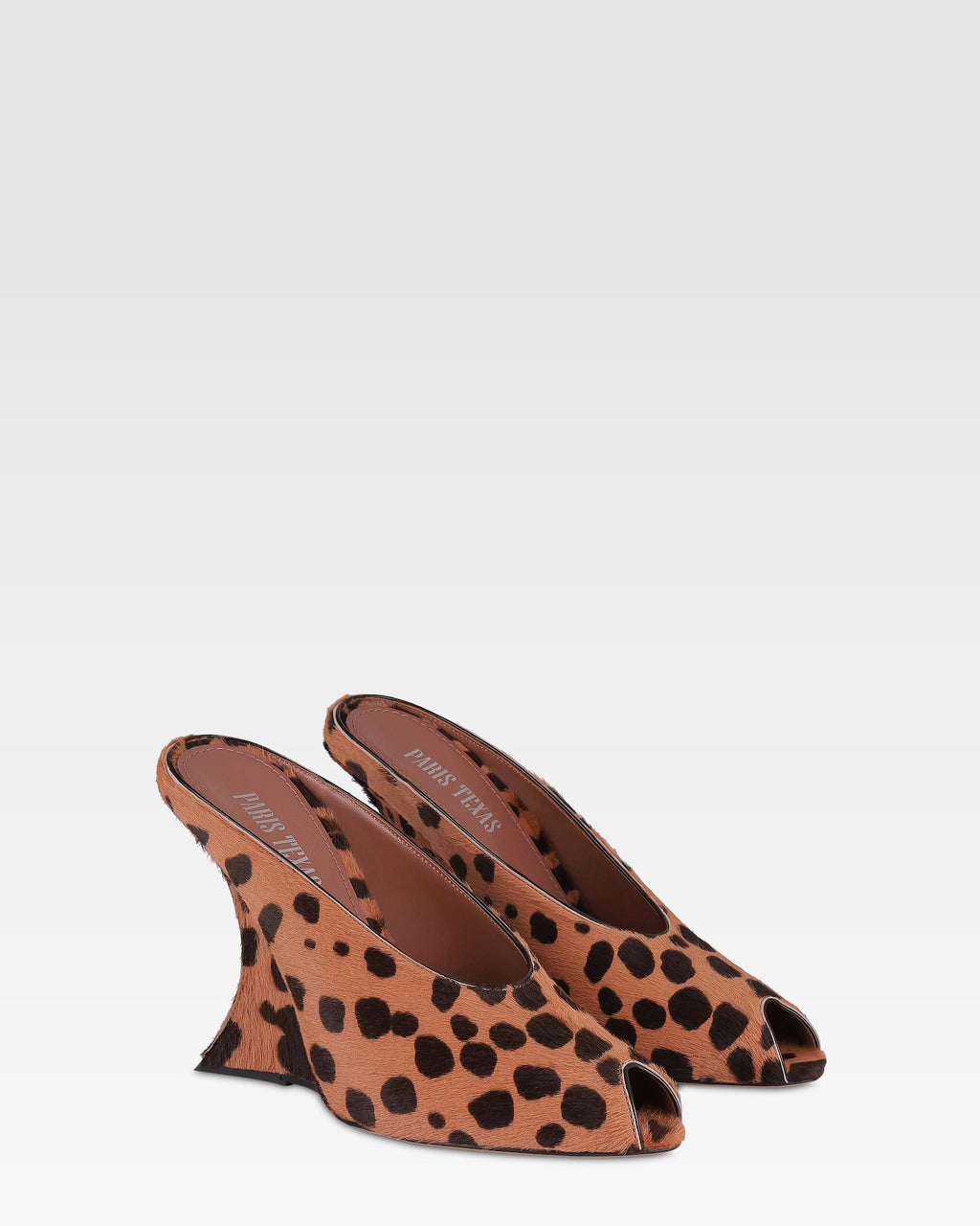 Open-toe sabots in caramel and dark brown printed cowhide