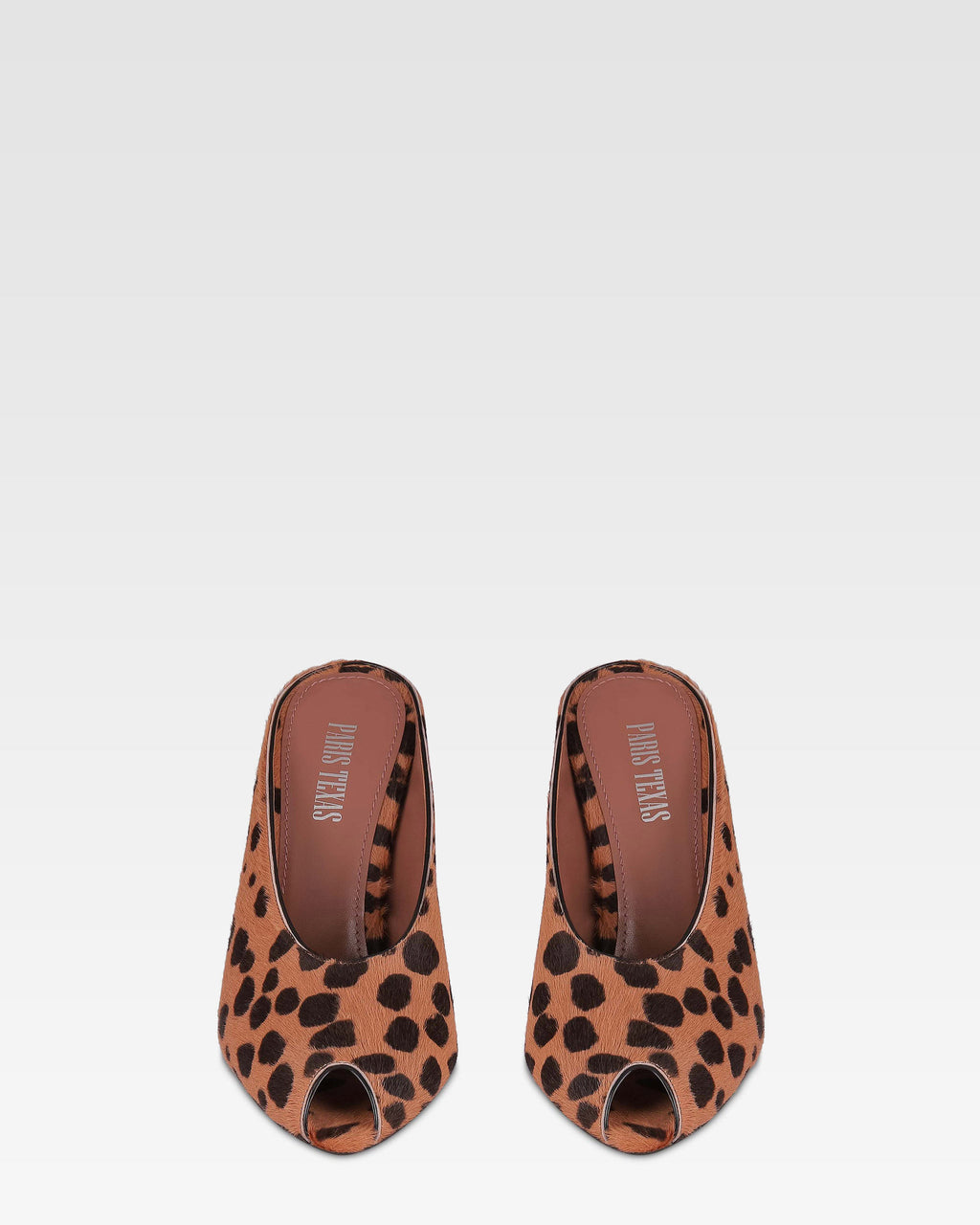 Open-toe sabots in caramel and dark brown printed cowhide