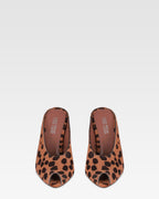 Open-toe sabots in caramel and dark brown printed cowhide