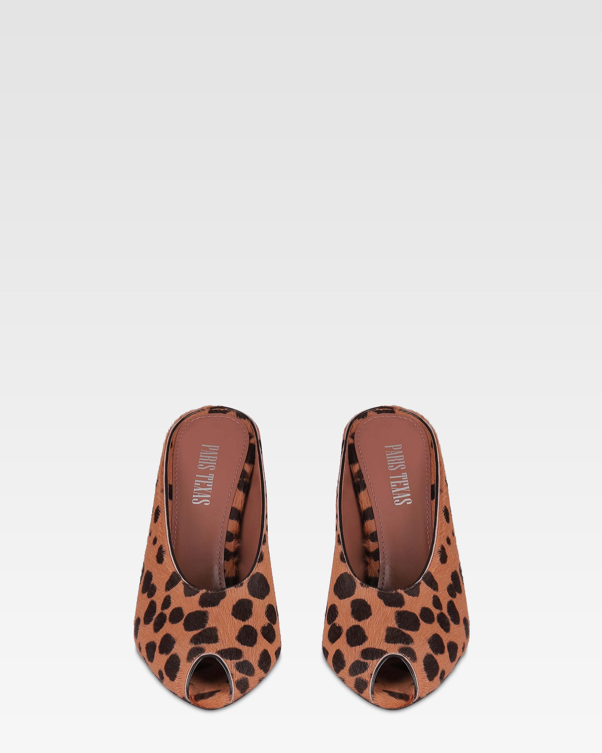 Open-toe sabots in caramel and dark brown printed cowhide