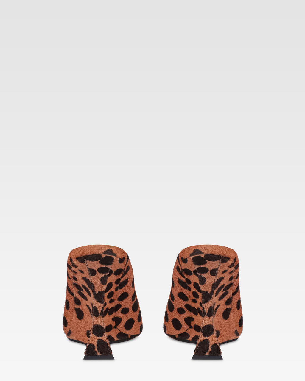 Open-toe sabots in caramel and dark brown printed cowhide