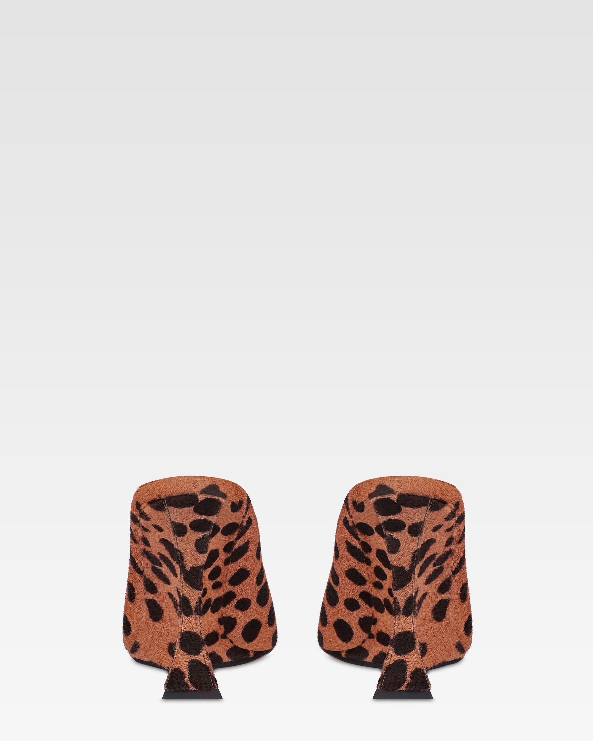 Open-toe sabots in caramel and dark brown printed cowhide