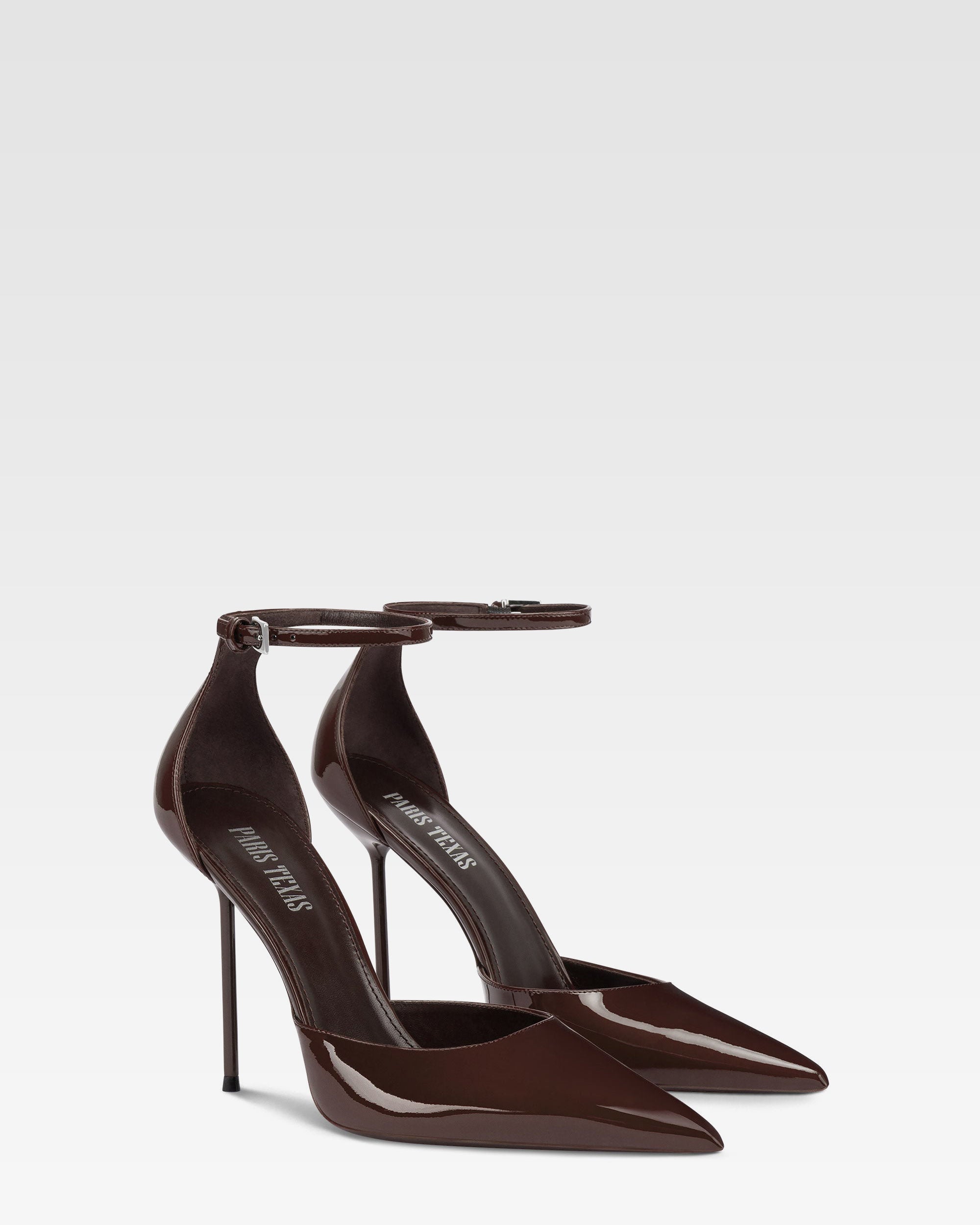 Ankle-strap pumps in ebony patent leather
