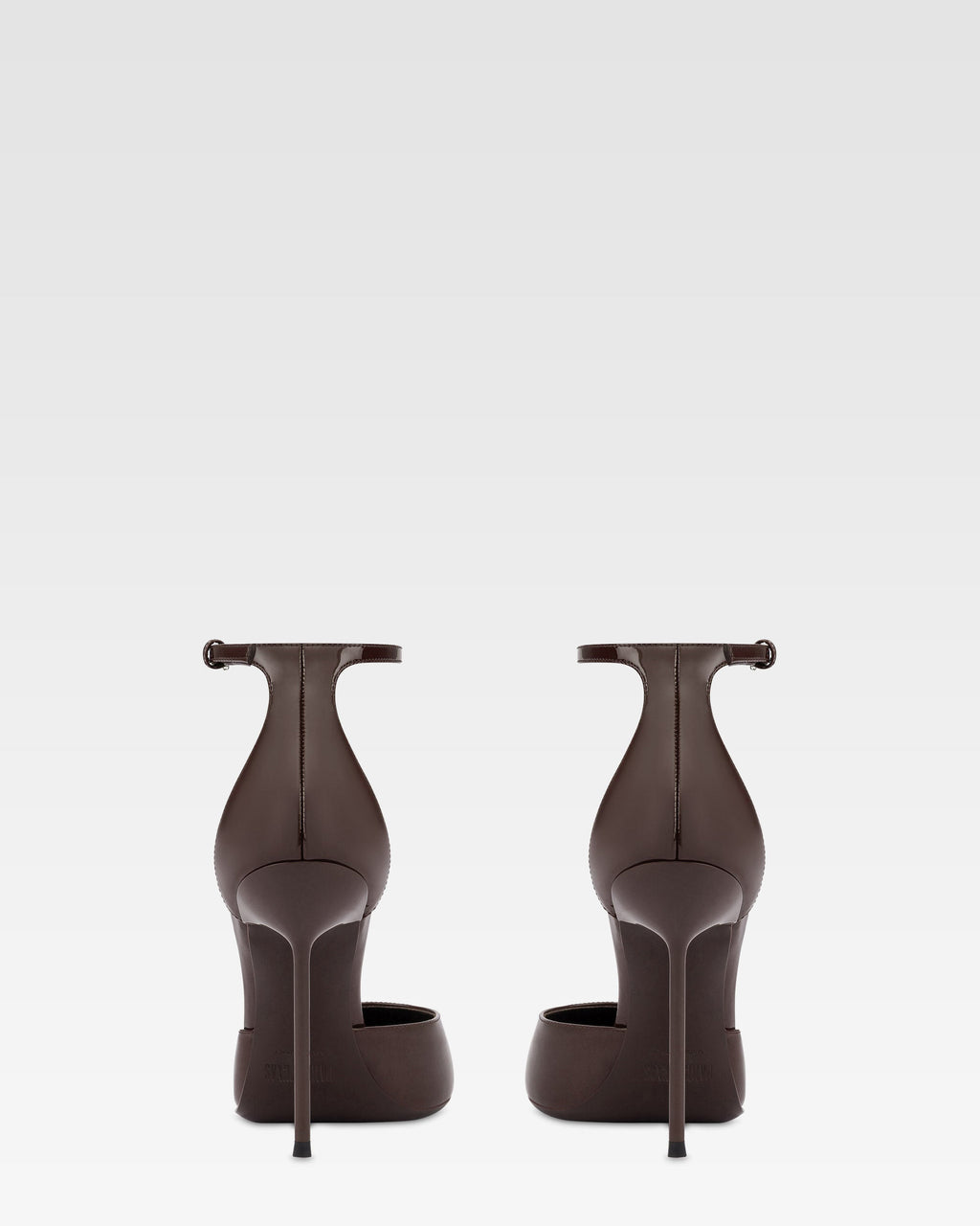 Ankle-strap pumps in ebony patent leather