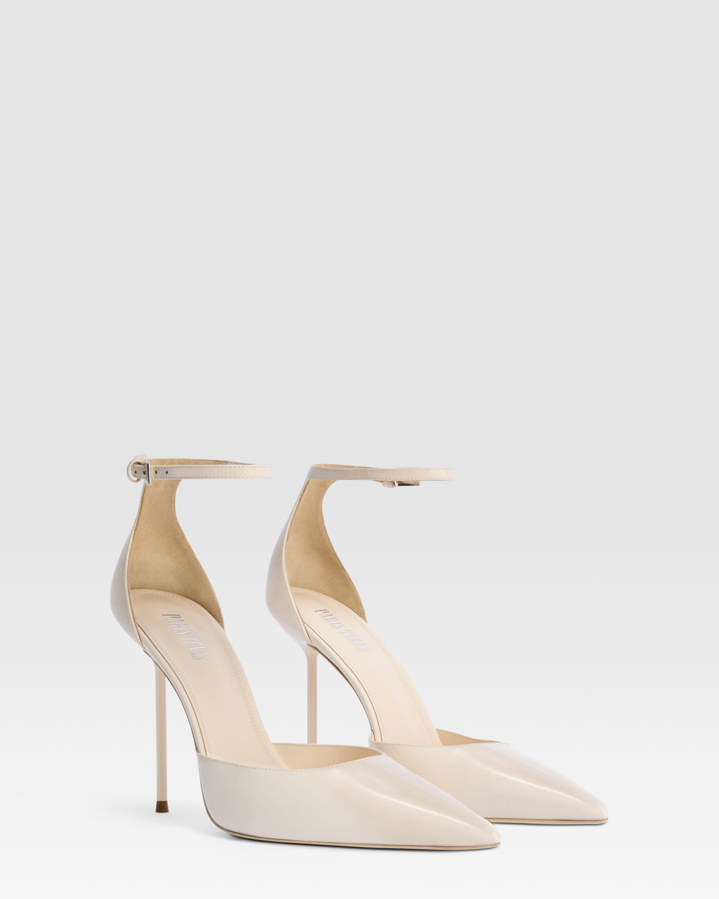 Ankle-strap pumps in ivory patent leather