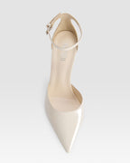 Ankle-strap pumps in ivory patent leather